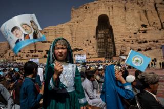 Afghans listen to speeches during the final campaign rally for presidential candiate Abdullah Abdullah in Bamiyan