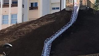 The closed slide is seen covered in safety ribbon