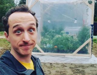 A photo of Kurtis Baute shows how he poses nervously in front of the plastic biodome