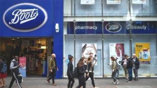 Customers outside Boots store