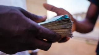 Man taking money