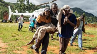 A wounded survivor is evacuated by helicopter from Chimanimani on March 19, 2019 to an hospital in Mutare,