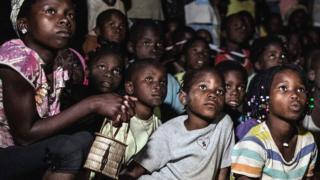 Children watching cartoon in Mozambique