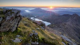 Sunrise over the Snowdonia national park as view from the summit of Snowdon