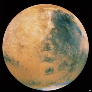 Colour-enhanced fish-eye view of Mars made from a mosaic of images taken by Viking Orbiter