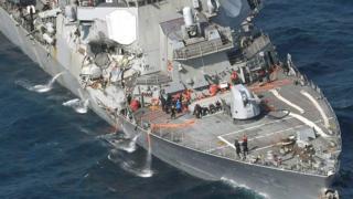 Helicopter images show the damaged ship