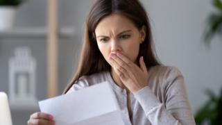 Woman shocked at letter