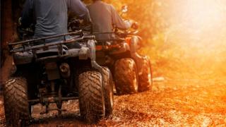 quad bikes on a dirt track