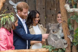 The Duke and Duchess of Sussex meet a koala called Ruby during a visit to Taronga Zoo in Sydney on the first day of the royal couple