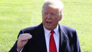 US President Donald Trump speaks to the media before departing on Marine One at the White House on 22 October 2018 in Washington, DC