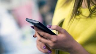 woman holding smartphone