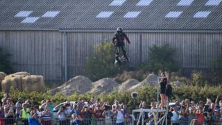 Franky Zapata stands on his jet-powered flyboard as he takes off from Sangatte