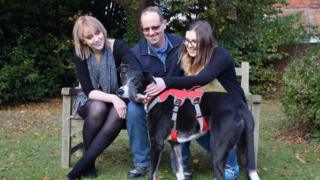 Bud with his new owners, the Corns family