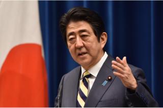 Japan's Prime Minister Shinzo Abe answers questions during his New Year press conference at his official residence in Tokyo on 4 January 2016.