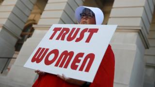 A woman protesting Georgia's new restrictive abortion laws in May 2019