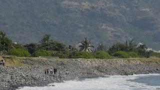 People search Jamaica beach for possible aircraft debris 02/08/2015