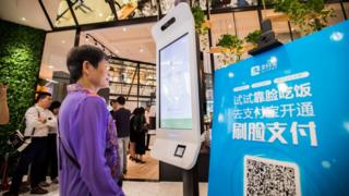 A customer tries Alipay"s facial recognition payment solution "Smile to Pay" at KFC"s new KPRO restaurant in Hangzhou, Zhejiang province, China September 1, 2017