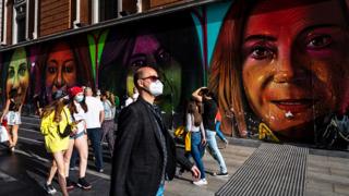 People wearing face masks on Gran Via Street in Madrid, Spain - 13 June 2020