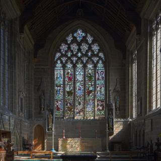 The stained glass window at St John the Baptist Church in the village of Tideswell in Derbyshire