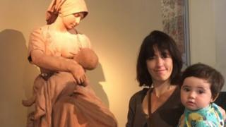 The woman posted a photo on twitter posing with her son next to a statue of a woman breastfeeding