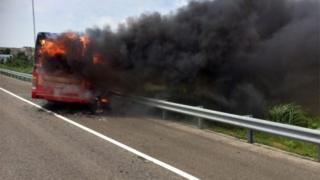 A handout photo released by the Taoyuan City Fire Department shows a tourist coach near the Taoyuan International Airport outside Taipei, Taiwan, 19 July 2016.