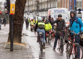 Cyclists form a line to protect a cycle lane in Penton Street, London, 13 December 2017
