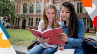 Female students studying outdoors