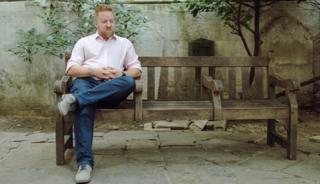 Man sat alone on a bench