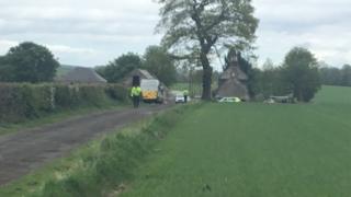 Police at farm building