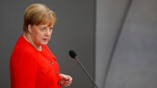 Angela Merkel addresses the Bundestag