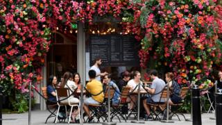 People sitting outside a restaurant