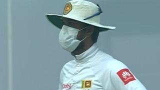 Sri Lanka captain Dinesh Chandimal wearing a mask while fielding against India in Delhi