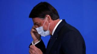 President Jair Bolsonaro reacts during a ceremony to launch a program to expand access to credit at the Planalto Palace in Brasilia, Brazil, August 19, 2020.