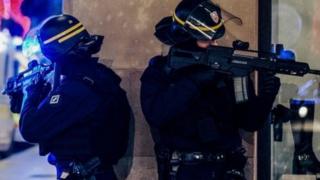 French police stand guard near the scene of a shooting in Strasbourg, eastern France, 11 December 2018