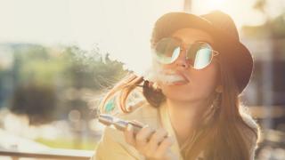 Woman smoking an e-cigarette