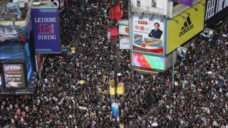 Tens of thousands throng Hong Kong's streets