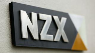 The NZX stock exchange logo is seen on a plaque on a wall in this file photo