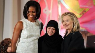 US First Lady Michelle Obama (L) and Secretary of State Hillary Clinton pose with Samar Badawi of Saudi Arabia as she receives the 2012 International Women of Courage Award during a ceremony at the US State Department in Washington DC