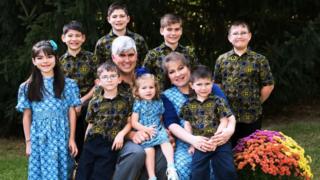 Charles Wesco pictured with his wife and eight children