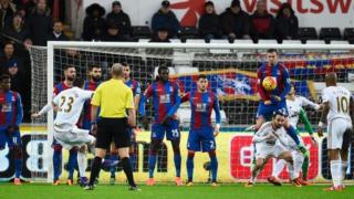 Gylfi Sigurdsson scores from a free-kick