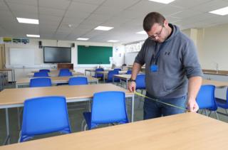 Wed Aug 26, 2020. Table gaps are measured in a class room, as preparations are made for the new school term at Alderwood School in Aldershot, Hampshire.