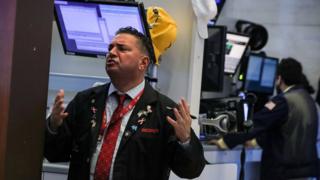 Traders work on the floor of the New York Stock Exchange (NYSE) in New York, U.S.,