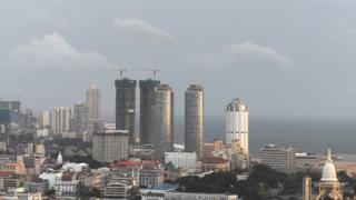 The Sri Lankan capital Colombo is seen from a Sri Lankan Air Force helicopter returning from flood-hit districts on May 29, 2017. Heavy monsoon rains in Sri Lanka triggered flooding and landslides that killed at least 91 people May 26 and left another 110 missing, authorities said. / AFP PHOTO / ISHARA S. KODIKARA (Photo credit should read ISHARA S. KODIKARA/AFP/Getty Images)