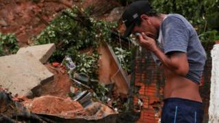 A man cries at the site of a mudslide in Guarujá, São Paulo state, Brazil. Photo: 3 March 2020