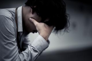 Business man is stressed from his work. depression and anxiety concept.