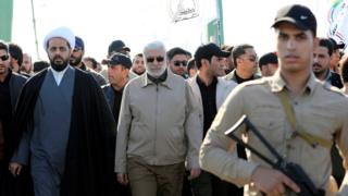 Image shows Abu Mahdi al-Muhandis (centre)