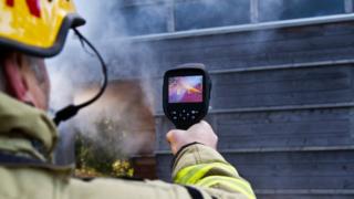 Firefighter using infrared camera