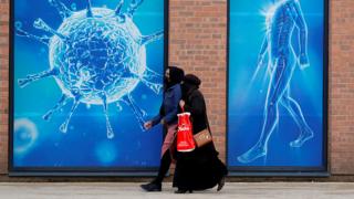 Women in masks in Oldham