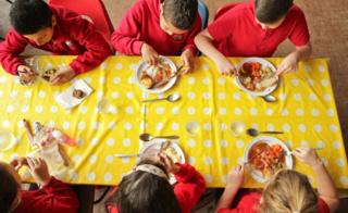 Children eating school dinners