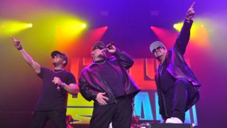 Adam Emil, Bryan Abrams and Mark Calderon of Color Me Badd performing in 2017
